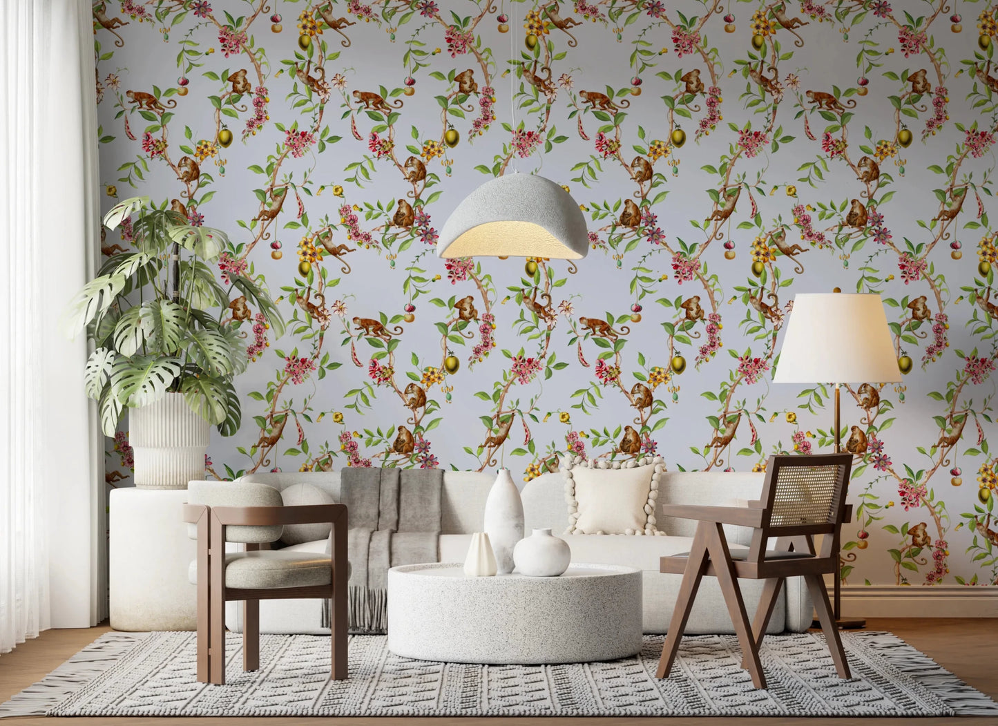 Open lounge space shaped by vintage monkey garden blue wallpaper and leafy branches