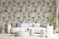 A soft living area paired with monkey garden blue wallpaper and airy botanical vines