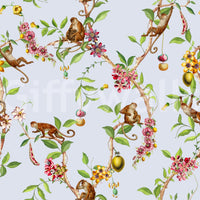 Blue exotic garden wallpaper with playful monkeys sitting along detailed leafy branches
