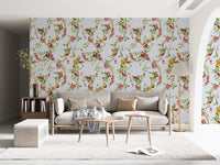 Bedside view where monkey family blue wallpaper creates a calm floral backdrop