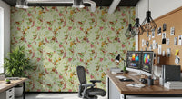Home office finished in exotic monkey garden green wallpaper with leafy detail
