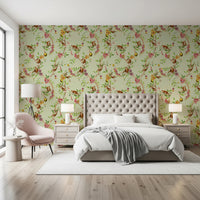 Bedroom backed by monkey family vintage green wallpaper and winding branches
