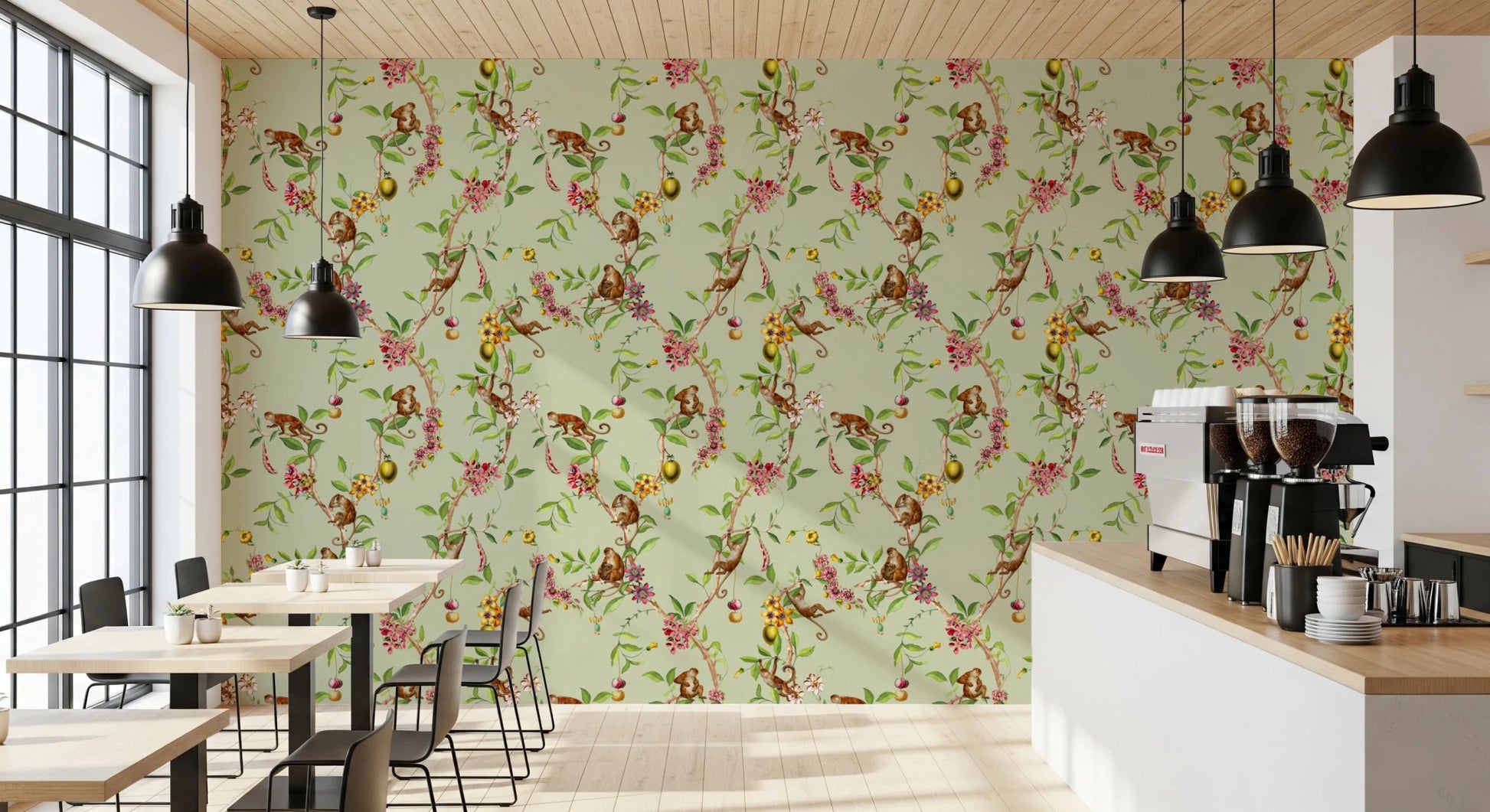 Cafe wrapped in whimsical monkey garden green wallpaper with soft florals
