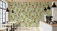 Cafe wrapped in whimsical monkey garden green wallpaper with soft florals
