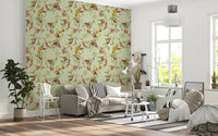 Living room corner styled in monkey family green wallpaper with vintage floral vines