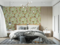 Bedroom brightened by vintage monkey garden green wallpaper and floral branches
