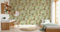 Green monkey garden wallpaper creating a calm bedroom feature behind the bed