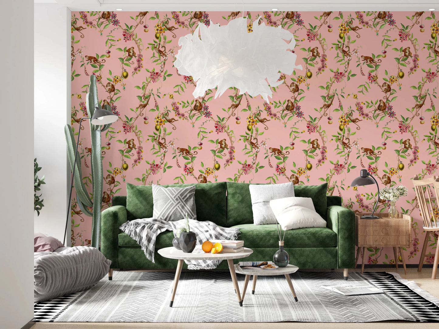 Green sofa nook brought to life with exotic garden pink wallpaper and leafy branches
