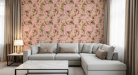 Sectional seating paired with playful monkey garden wallpaper in a soft pink tone