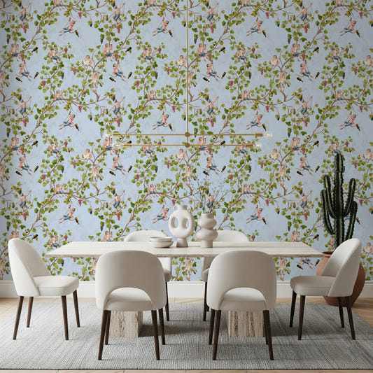 A clean dining room scene styled with blue vineyard monkey wallpaper and soft vine spread

