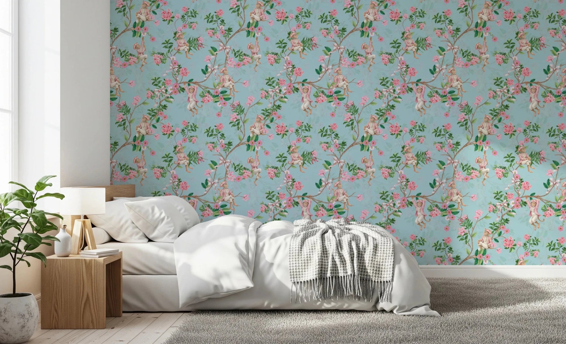 Bedroom softened by whimsical rococo monkey wallpaper and pink flower trails
