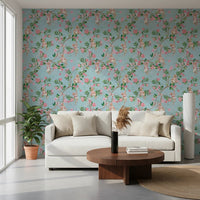 Open sofa space finished in vineyard party blue wallpaper with leafy branches