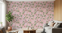 Living room corner showing pink monkey garden wallpaper with airy botanical detail, GD8585