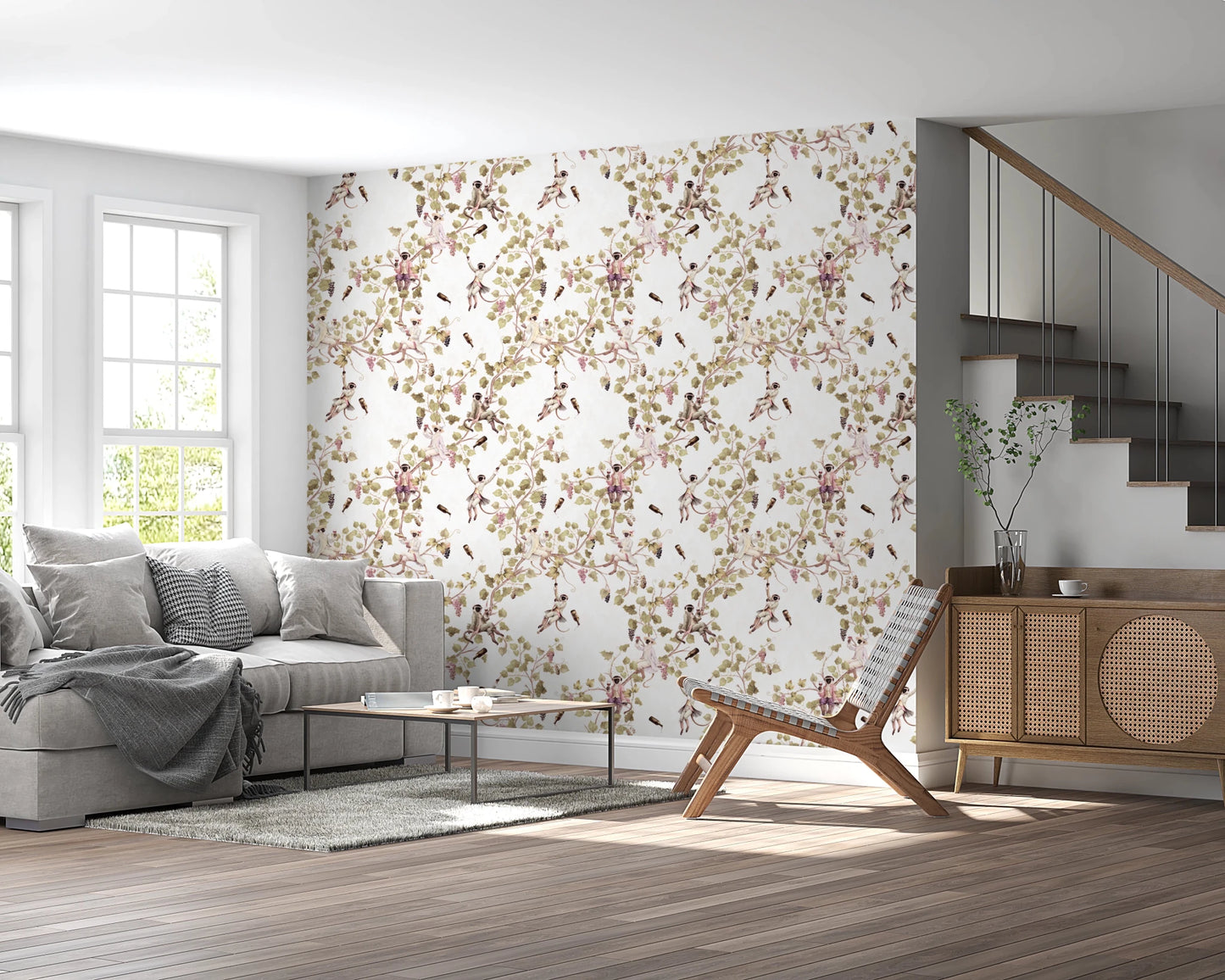 Living area near staircase wrapped in vineyard monkey wallpaper and vine patterns