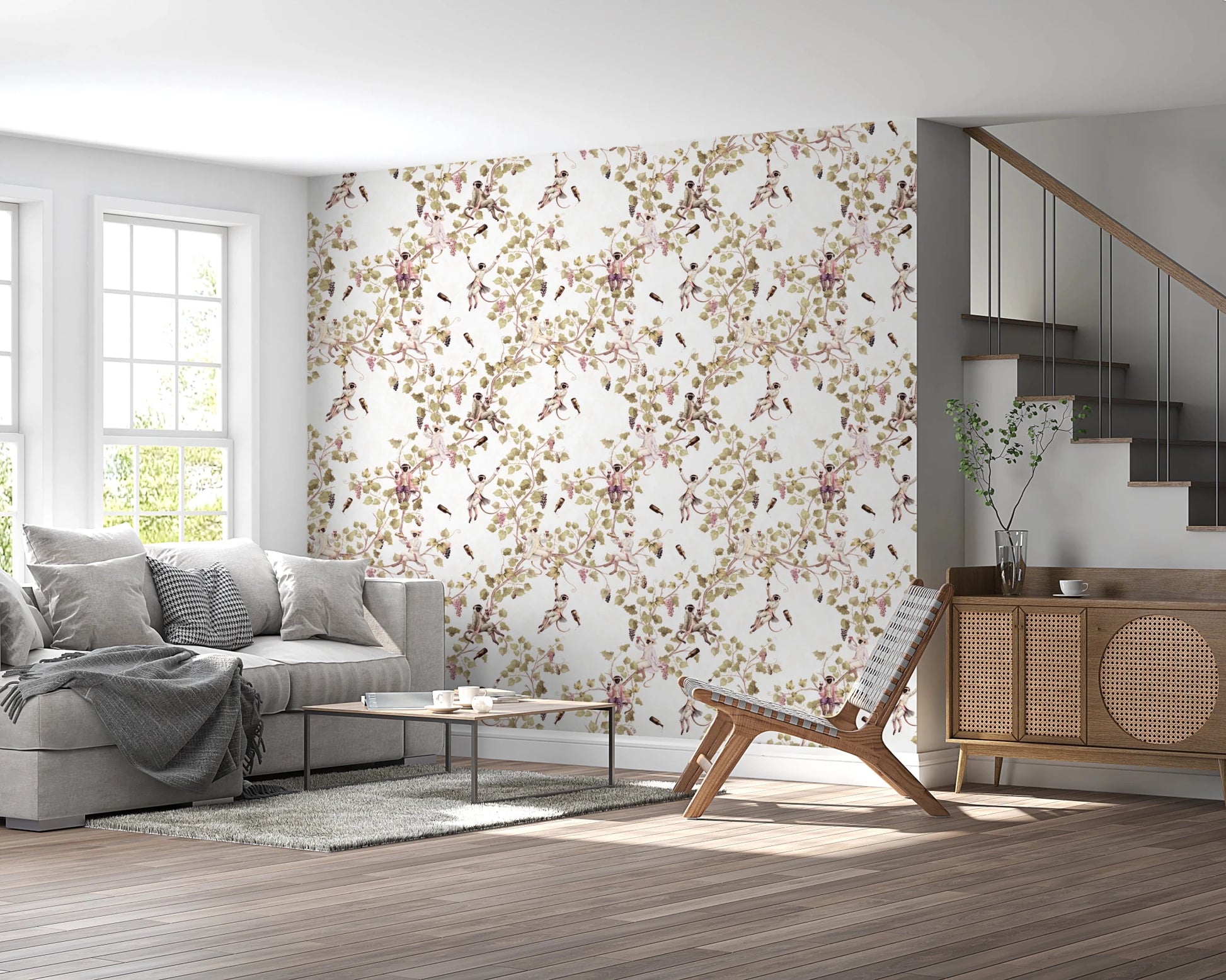 Living area near staircase wrapped in vineyard monkey wallpaper and vine patterns