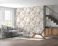 Living area near staircase wrapped in vineyard monkey wallpaper and vine patterns