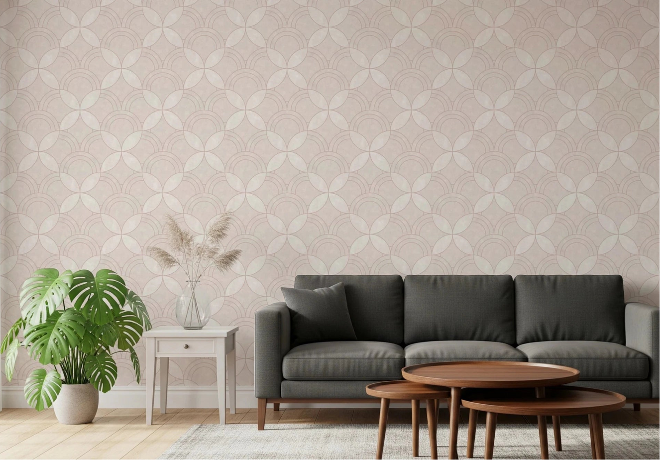 Living room scene with Whisper Arcs Wallpaper behind a dark sofa and wooden tables