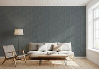 A small lounge corner picks up calm texture through Whispering Greige Waves wallpaper.GD9523