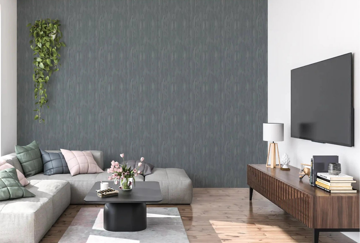 Moody slate strokes run across the living room behind the sofa on this Whispering Greige wallpaper.GD9523