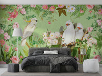 White cockatoos perched among blooming roses mural.


