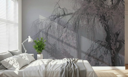 A quiet bedroom corner softened by Whispers of Spring wall mural blossoms