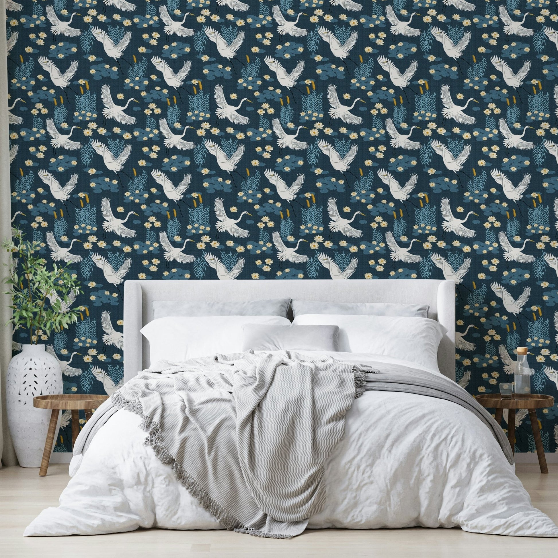 Nature-inspired blue wallpaper with heron motifs


