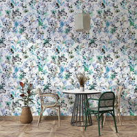 Light blue wallpaper featuring wild grass silhouettes.

