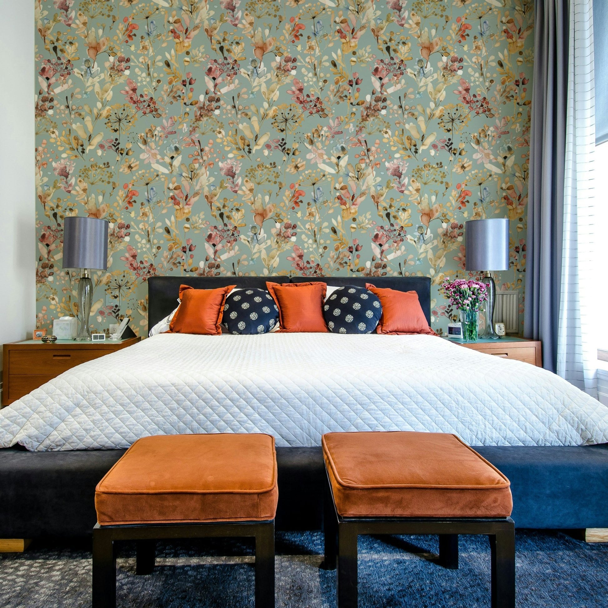 Luxurious teal wallpaper with golden botanical elements.

