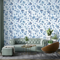 Soft blue botanical wallpaper with wild plants design

