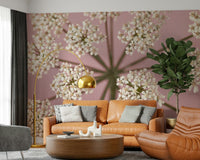 Floral wall mural with white botanical patterns on pink for a bedroom wallpaper.