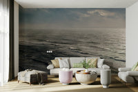 A peaceful open ocean mural on decorative wallpaper.


