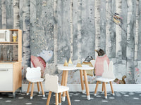 Playful woodland animals in snowy forest
