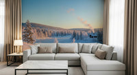 Winter's Light Cabin Wall Mural in a cozy living room with wooden decor wallpaper.