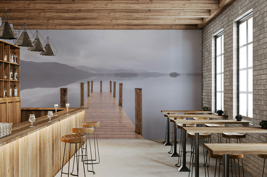 A wall mural of a wooden pier extending into a misty lake.

