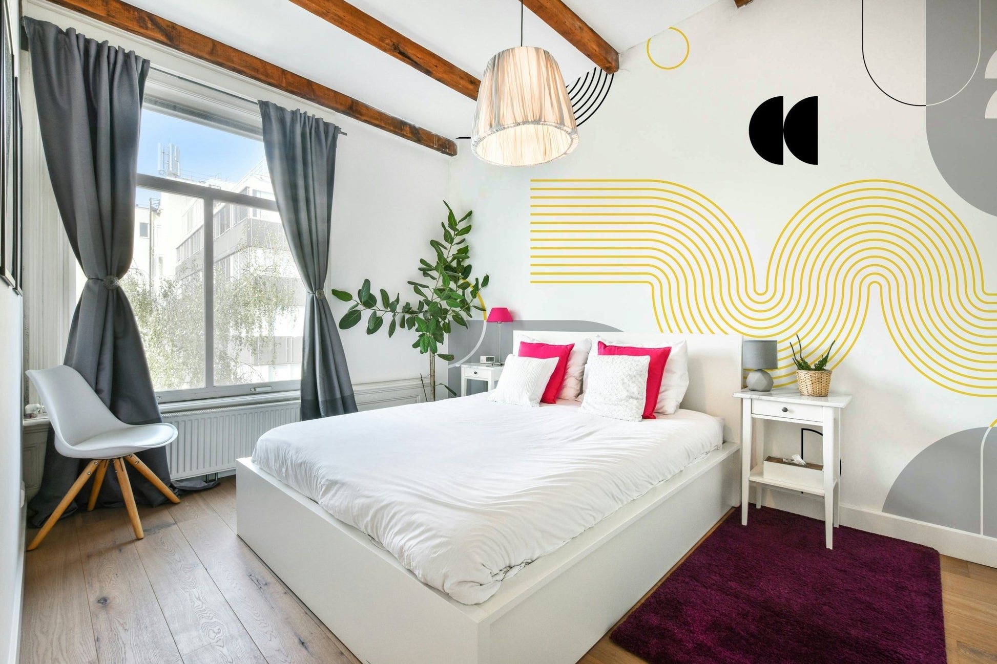 Close-up of yellow and gray geometric pattern mural

