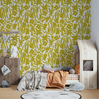 A child's playroom with a sunny yellow wall mural

