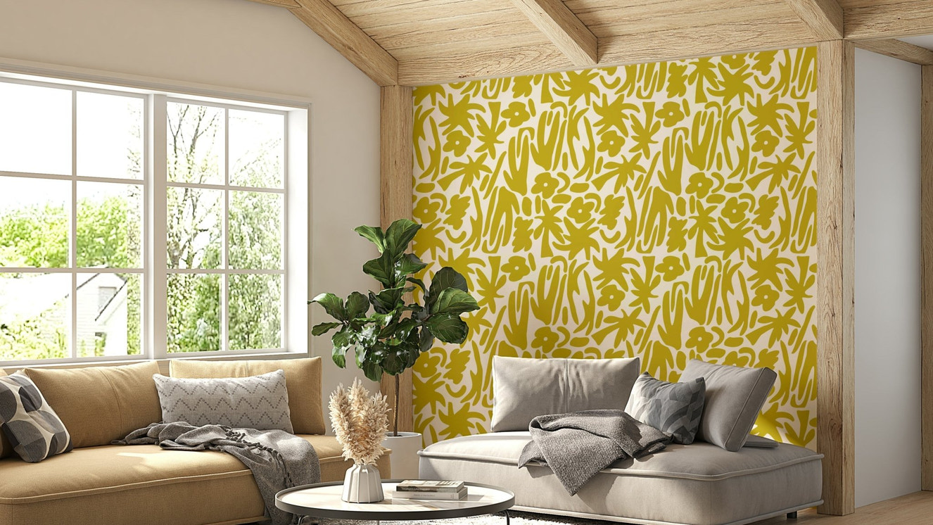 An angled shot of a wall with yellow mural

